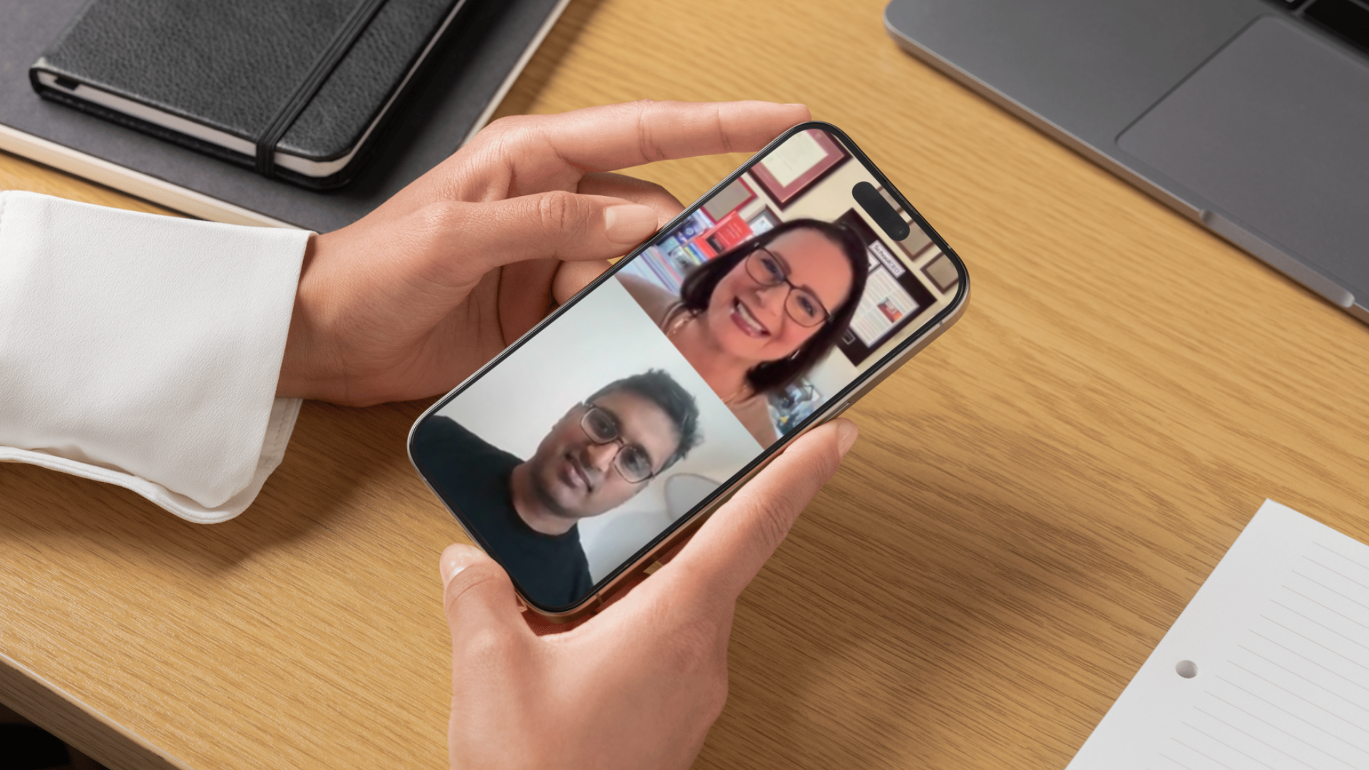 woman watching interview on iphone